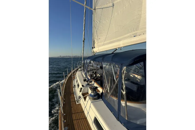 Slide: The Image of Sailing on a 2003 Beneteau 57 yacht with clear blue skies and ocean view. - 108