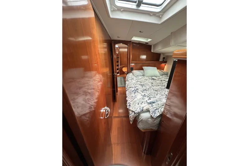 Slide: The Image of Luxurious cabin interior of a 2003 Beneteau 57 yacht with elegant wood finish. - 15
