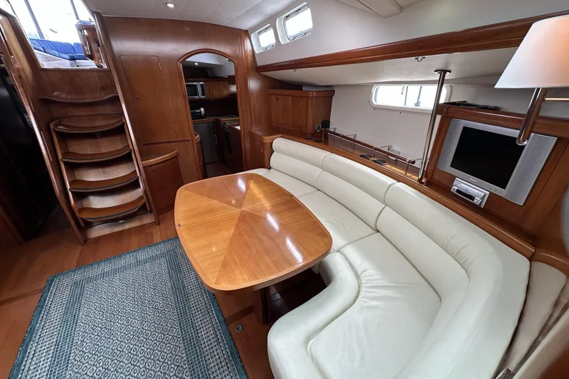 Slide: The Image of Luxurious interior of a 2003 Beneteau 57 yacht with elegant wood finishes. - 19
