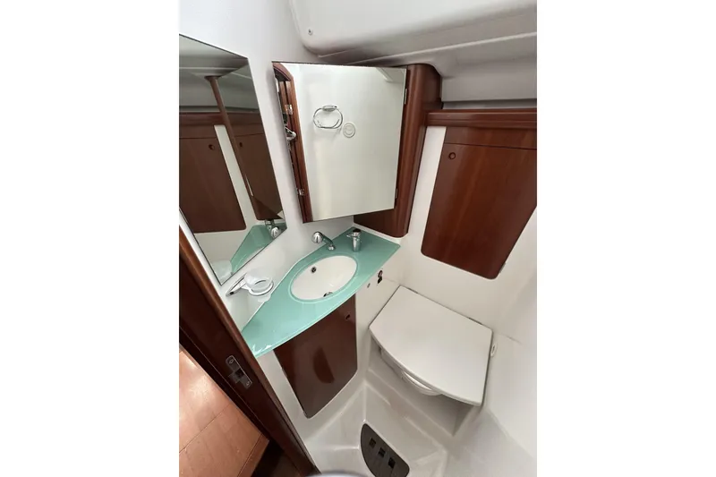 Slide: The Image of Bathroom interior of 2003 Beneteau 57 yacht with sink and mirror. - 35