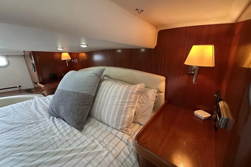 Slide: The Image of Luxurious cabin interior of a 2003 Beneteau 57 yacht with elegant wood paneling. - 41