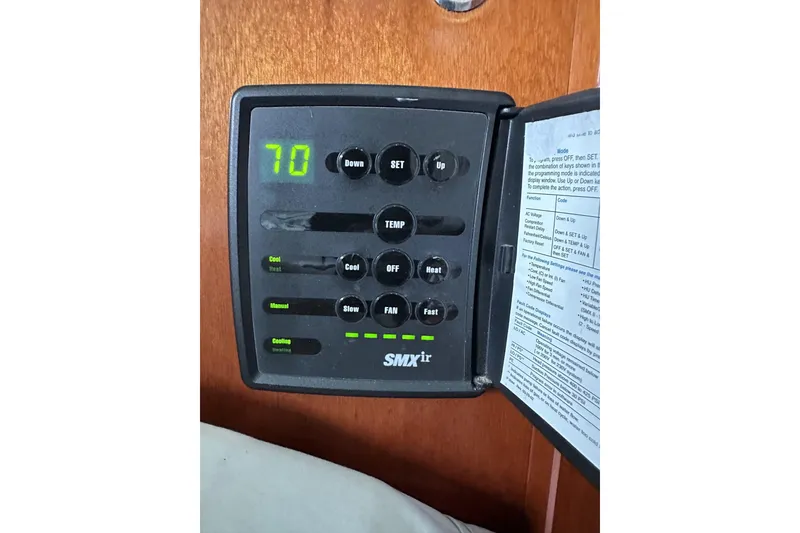 Slide: The Image of SMXir control panel on 2003 Beneteau 57 yacht, displaying temperature settings. - 42