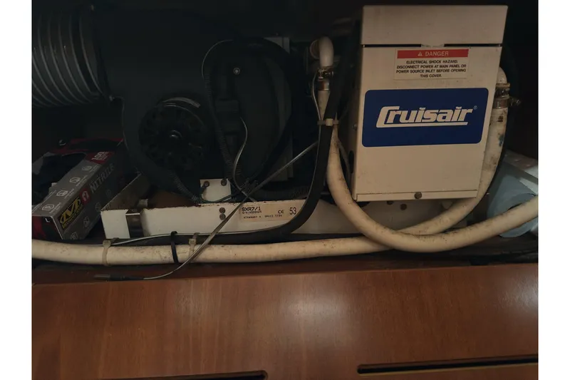 Slide: The Image of Cruisair unit in a 2003 Beneteau 57 yacht, showcasing electrical components and wiring. - 43