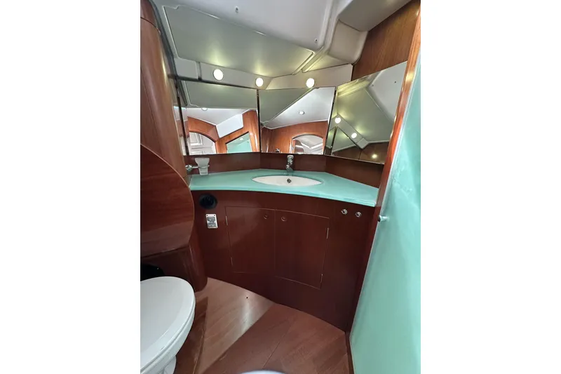 Slide: The Image of Luxurious bathroom interior of 2003 Beneteau 57 yacht with modern fixtures and wood accents. - 45