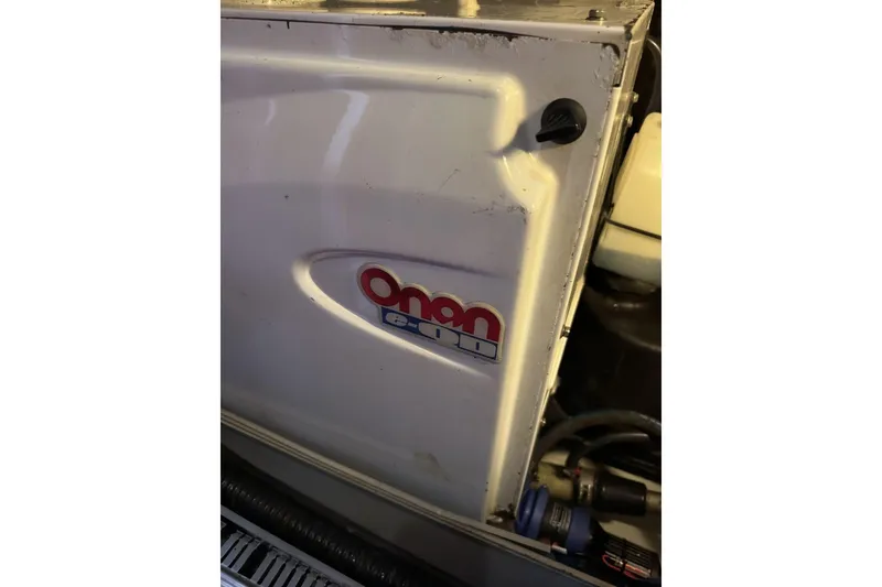 Slide: The Image of Onan generator in a 2003 Beneteau 57 yacht engine compartment. - 51