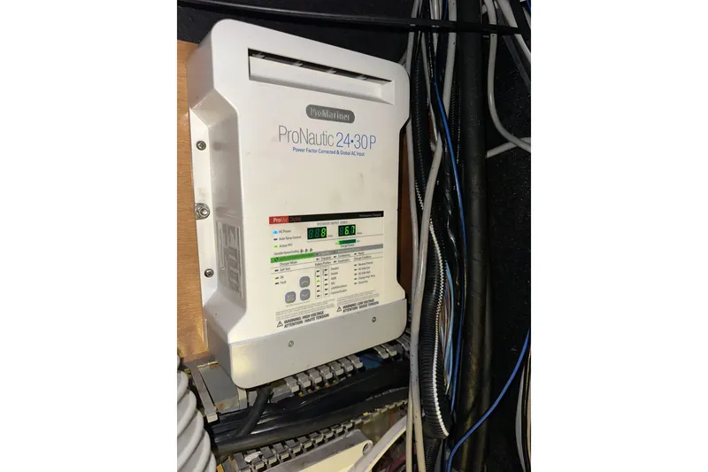 Slide: The Image of ProNautic 24-30P marine battery charger installed on a 2003 Beneteau 57 yacht. - 54