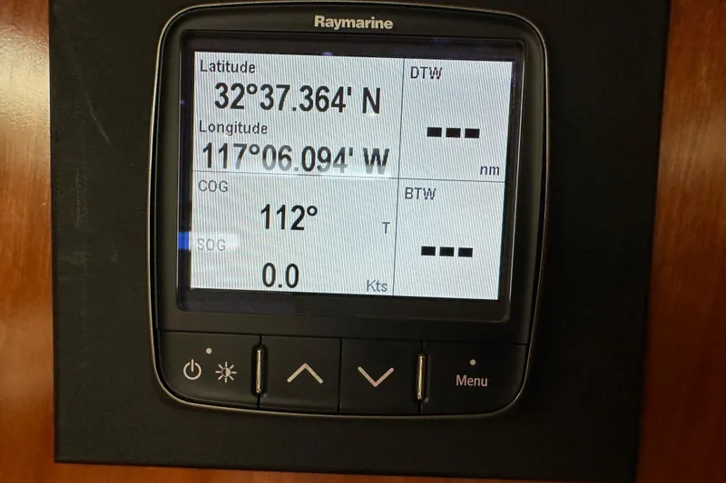 Slide: The Image of Raymarine navigation display showing coordinates on a 2003 Beneteau 57 yacht. - 56