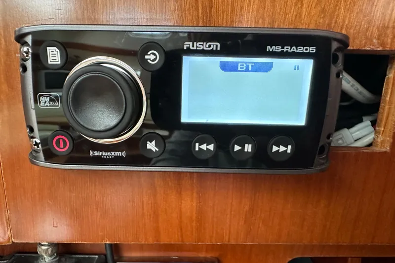 Slide: The Image of Fusion MS-RA205 stereo system on a 2003 Beneteau 57 yacht, displaying Bluetooth mode. - 57
