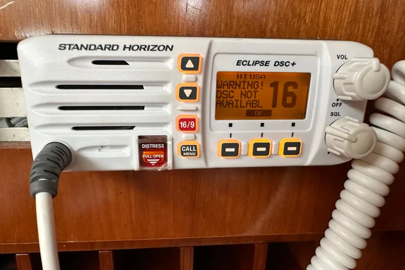 Slide: The Image of Standard Horizon Eclipse DSC+ radio on 2003 Beneteau 57 yacht, displaying warning message. - 58