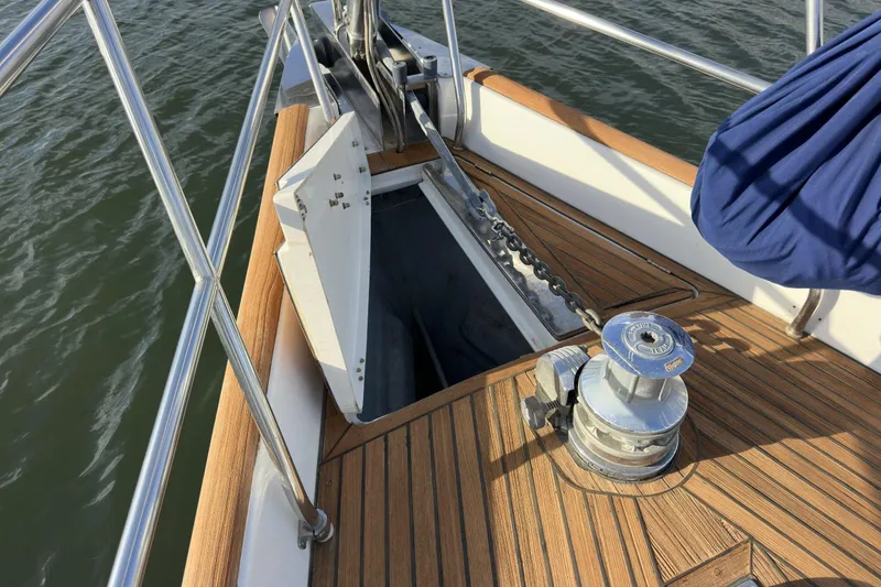 Slide: The Image of Deck of 2003 Beneteau 57 yacht with anchor chain and winch. - 71