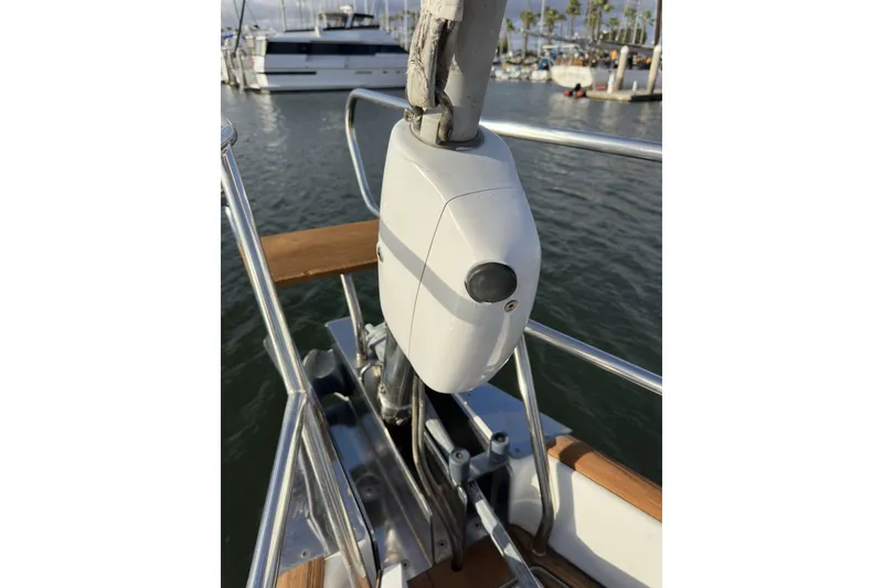 Slide: The Image of Bow view of a 2003 Beneteau 57 sailboat docked in a marina. - 73
