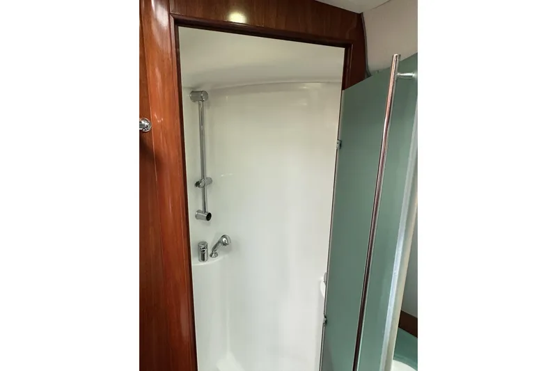 Slide: The Image of Shower area in 2003 Beneteau 57 yacht, featuring sleek design and modern fixtures. - 8