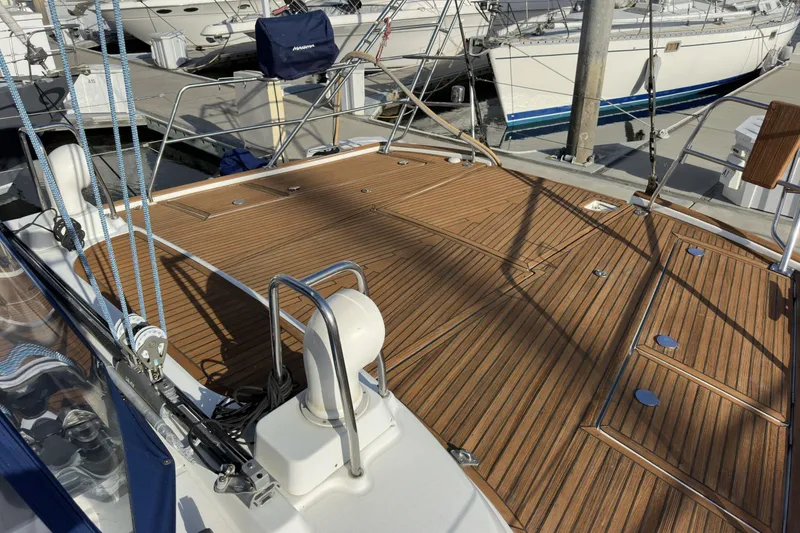 Slide: The Image of Deck of a 2003 Beneteau 57 yacht with teak finish and rigging details. - 80