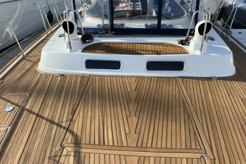 Slide: The Image of Teak deck of a 2003 Beneteau 57 yacht with sleek design elements. - 81