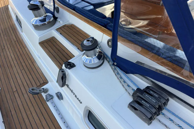 Slide: The Image of Deck of 2003 Beneteau 57 yacht with winches and teak flooring. - 84