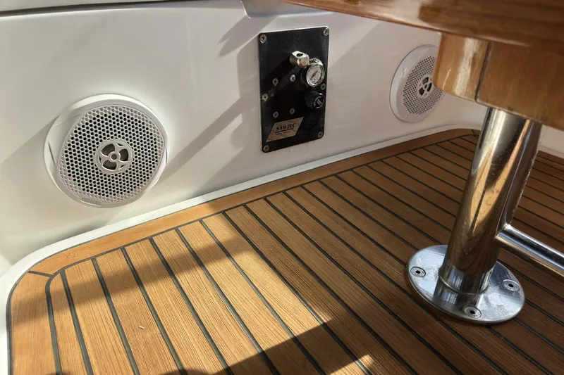 Slide: The Image of Interior of a 2003 Beneteau 57 yacht featuring speakers and teak flooring. - 94