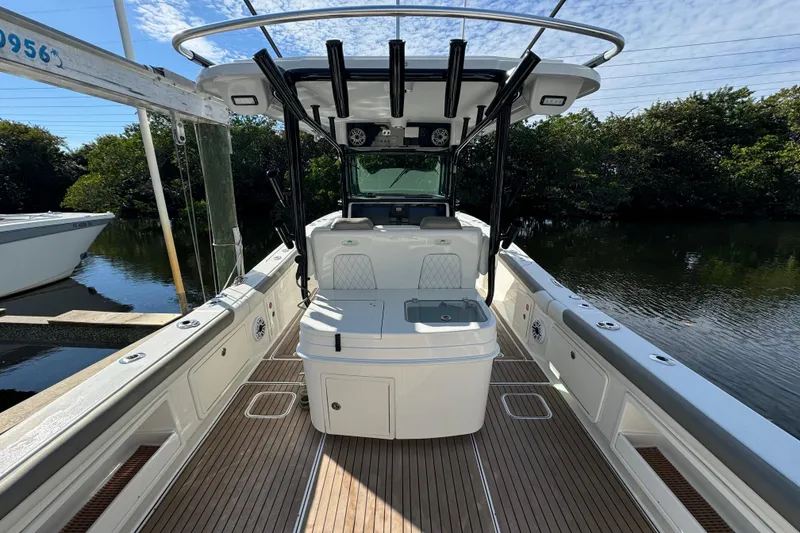 Slide: The Image of 2023 World Cat 325 CC boat interior with sleek design and spacious deck. - 12