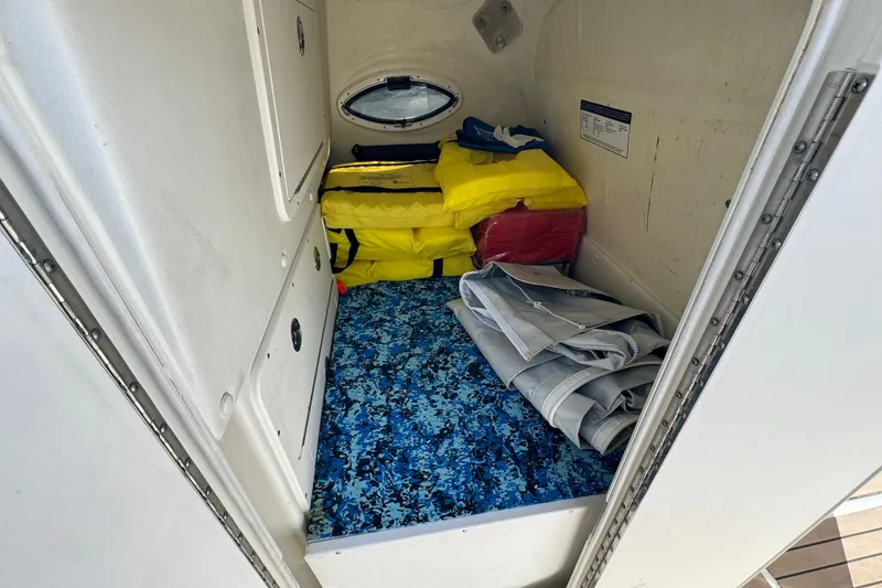 Slide: The Image of Interior cabin of 2023 World Cat 325 CC with life jackets and storage. - 20
