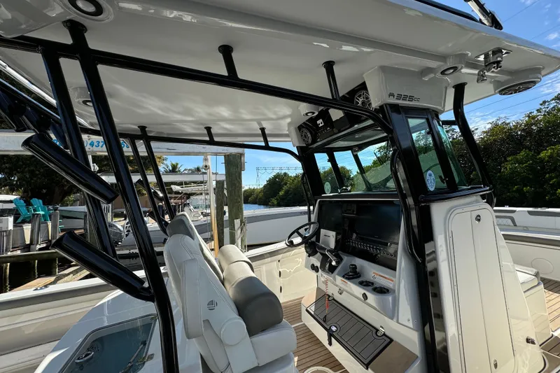 Slide: The Image of 2023 World Cat 325 CC boat interior with modern helm and seating. - 25