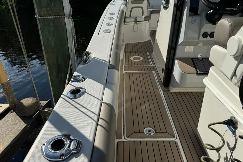 Slide: The Image of 2023 World Cat 325 CC boat interior with sleek deck and seating. - 36