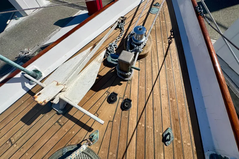 Slide: The Image of Deck of 1946 Phillip Rhodes 42 sailboat with anchor and ropes. - 18