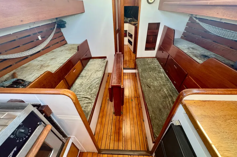 Slide: The Image of Vintage 1946 Phillip Rhodes 42 sailboat interior with wooden bunks and flooring. - 20