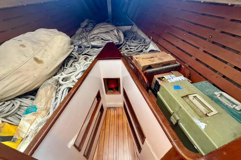 Slide: The Image of Interior of a 1946 Phillip Rhodes 42 boat with ropes and storage boxes. - 32