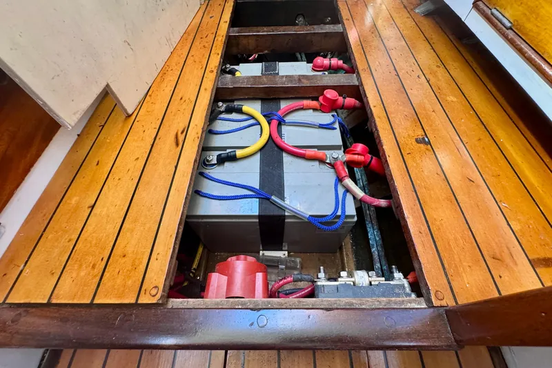 Slide: The Image of Battery compartment of a 1946 Phillip Rhodes 42 boat with wooden flooring. - 39