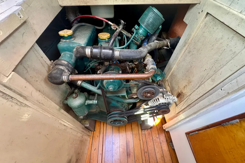 Slide: The Image of Engine of a 1946 Phillip Rhodes 42 boat, showcasing vintage mechanical components. - 44