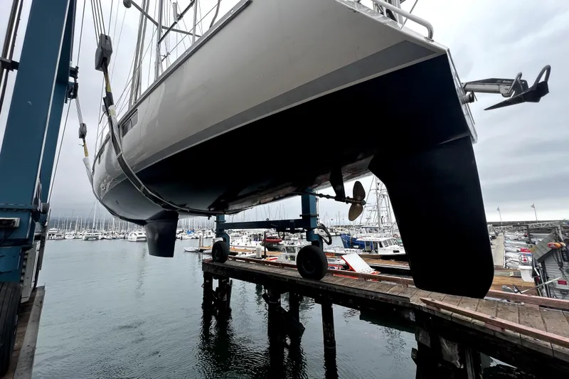 Slide: The Image of Sundeer 56 sailboat from 1995 being lifted at a marina dock. - 30