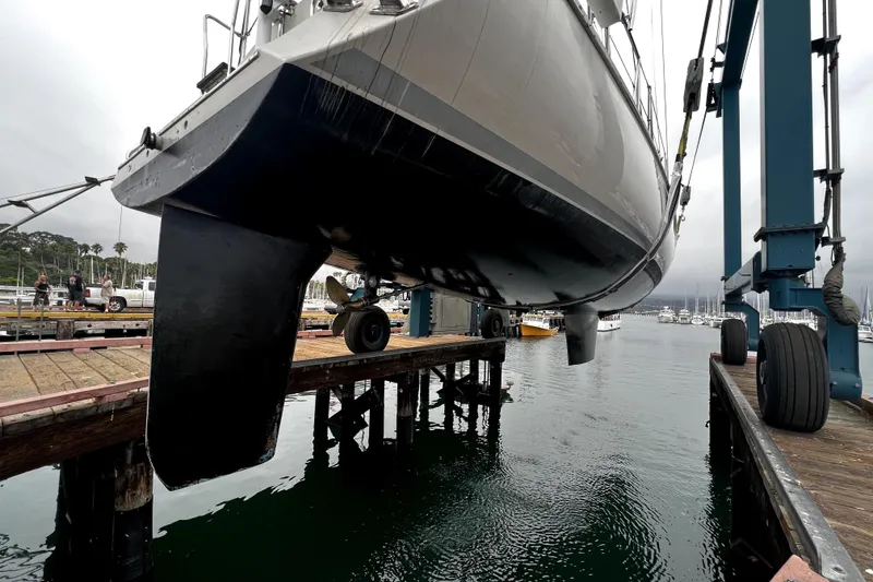 Slide: The Image of Sundeer 56 yacht from 1995 being lifted at a marina dock. - 31