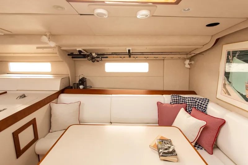 Slide: The Image of Cozy interior of 1995 Sundeer 56 yacht with white seating and decorative pillows. - 34
