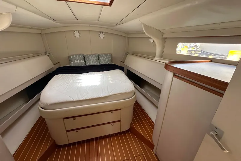 Slide: The Image of Cozy cabin interior of 1995 Sundeer 56 yacht with bed and wooden flooring. - 39