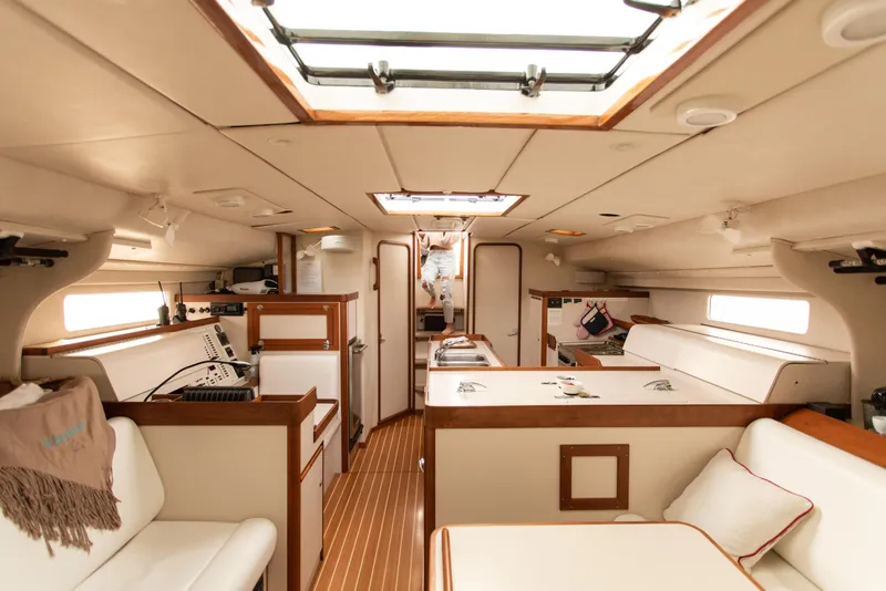 Slide: The Image of Interior of a 1995 Sundeer 56 yacht, featuring a spacious and elegant cabin design. - 41