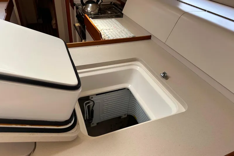 Slide: The Image of Built-in cooler in a 1995 Sundeer 56 yacht kitchen. - 50