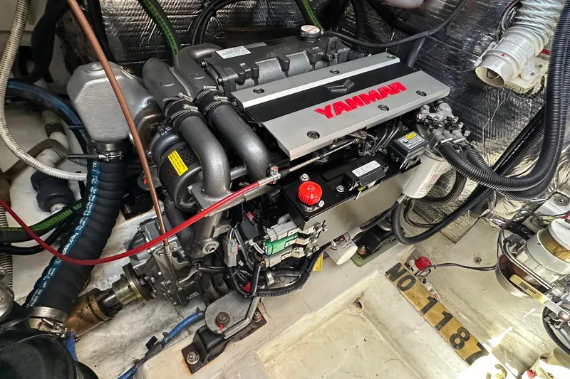 Slide: The Image of Engine compartment of a 1995 Sundeer 56 yacht featuring a Yanmar engine. - 52