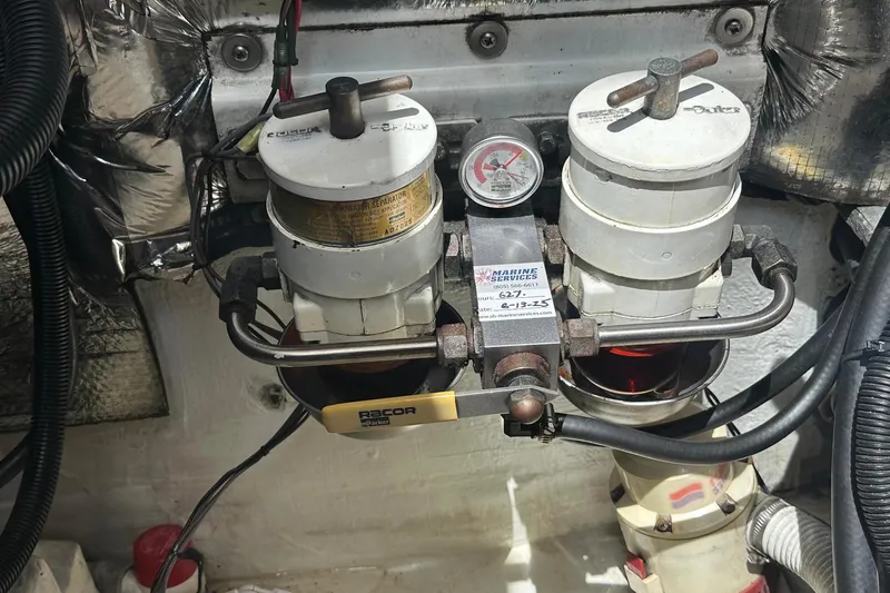 Slide: The Image of Engine room with dual Racor fuel filters in a 1995 Sundeer 56 yacht. - 54