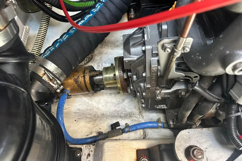 Slide: The Image of Close-up of a 1995 Sundeer 56 engine compartment with visible hoses and components. - 55