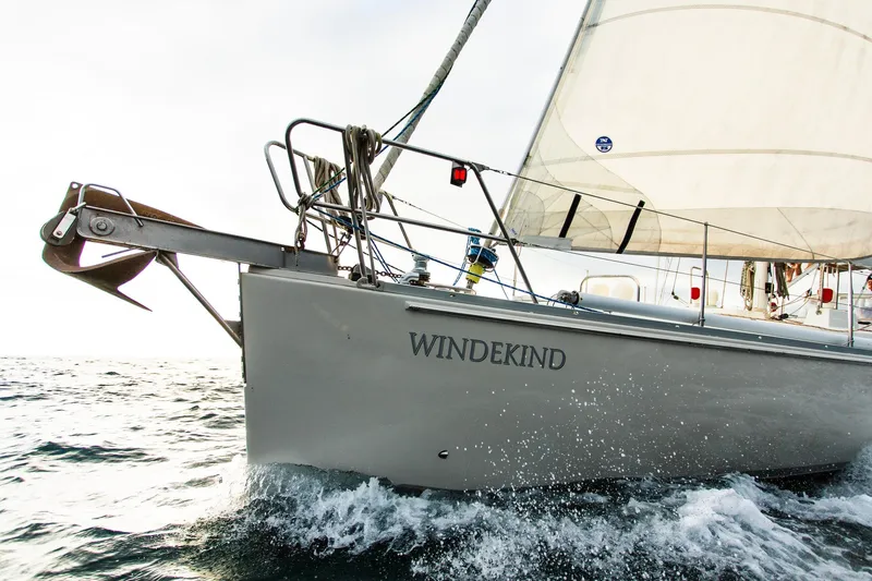 Slide: The Image of Sundeer 56 sailboat "Windekind" from 1995 navigating ocean waters with sails unfurled. - 9