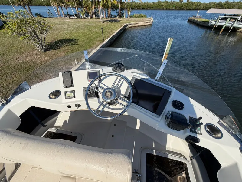 Slide: The Image of 2013 Ranger Tugs R-31 CB helm station by the water. - 17