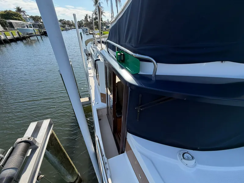 Slide: The Image of 2013 Ranger Tugs R-31 CB at dock, side view. - 24