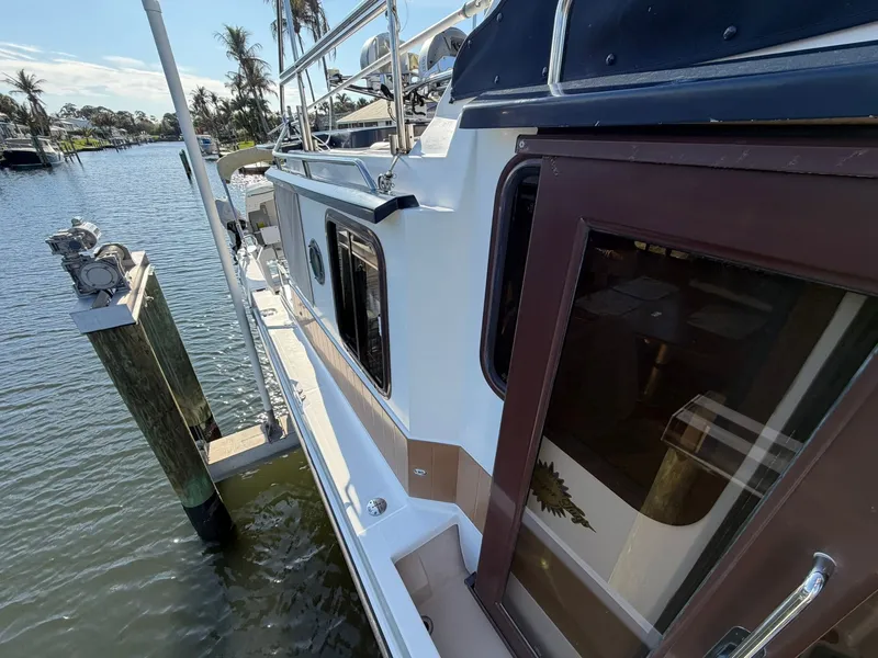 Slide: The Image of 2013 Ranger Tugs R-31 CB at dock, sunny day. - 25