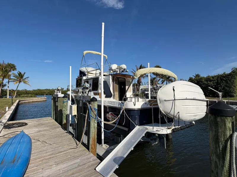 Slide: The Image of Ranger Tugs R-31 CB 2013 at dock with blue kayak. - 3