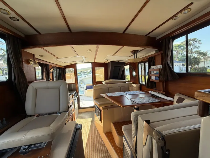 Slide: The Image of Interior of 2013 Ranger Tugs R-31 CB yacht with elegant wood finish. - 32