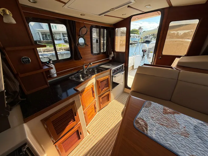 Slide: The Image of Interior of a 2013 Ranger Tugs R-31 CB yacht with kitchen. - 33