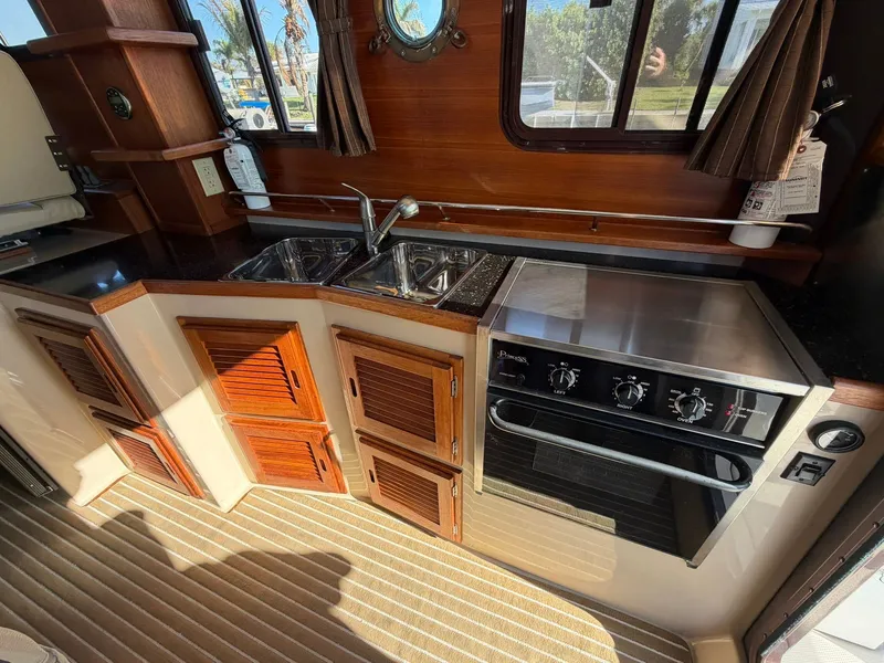 Slide: The Image of Interior view of a 2013 Ranger Tugs R-31 CB yacht kitchen. - 34