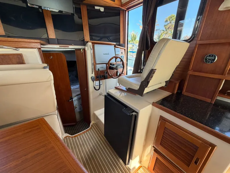 Slide: The Image of Interior of a 2013 Ranger Tugs R-31 CB with helm station. - 38