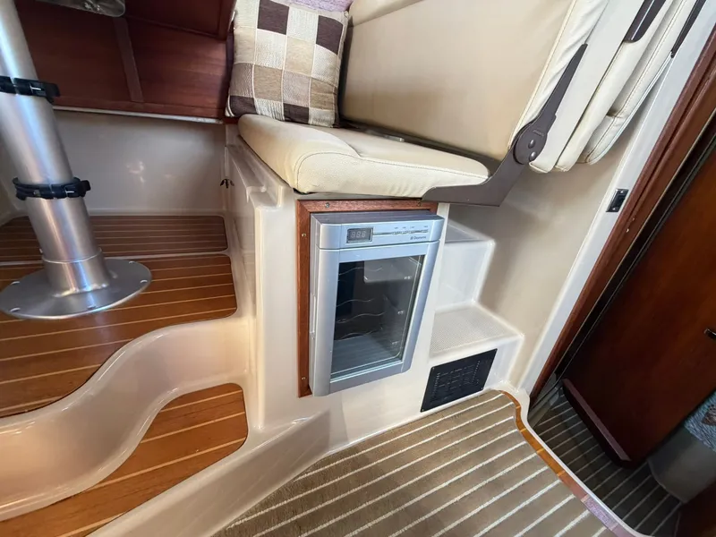 Slide: The Image of Interior of 2013 Ranger Tugs R-31 CB with fridge and seating area. - 40