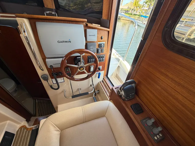 Slide: The Image of Interior view of a 2013 Ranger Tugs R-31 CB helm station. - 42