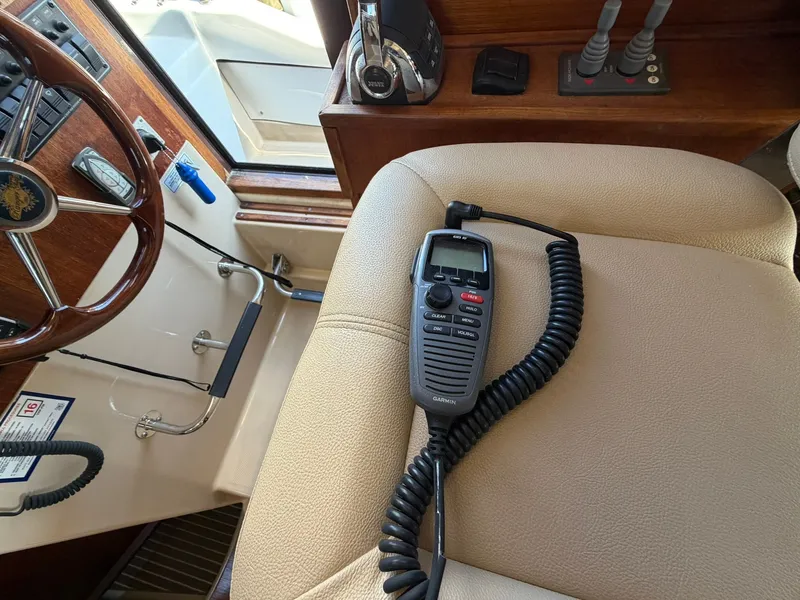 Slide: The Image of Interior of a 2013 Ranger Tugs R-31 CB with radio equipment. - 44